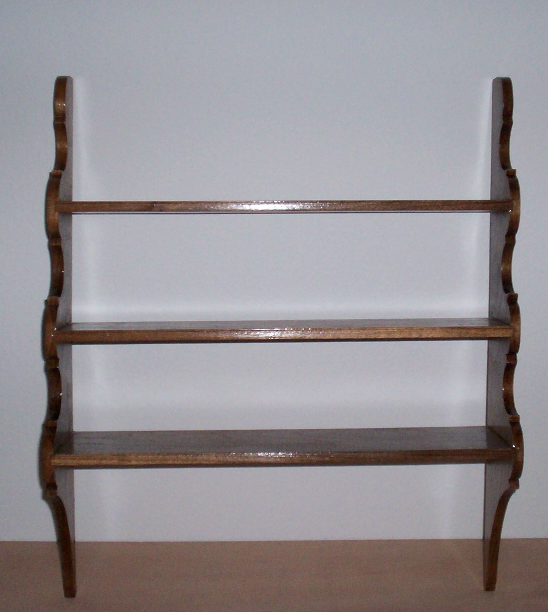 This shelf is easily mounted to the wall. Is perfect for showing off 