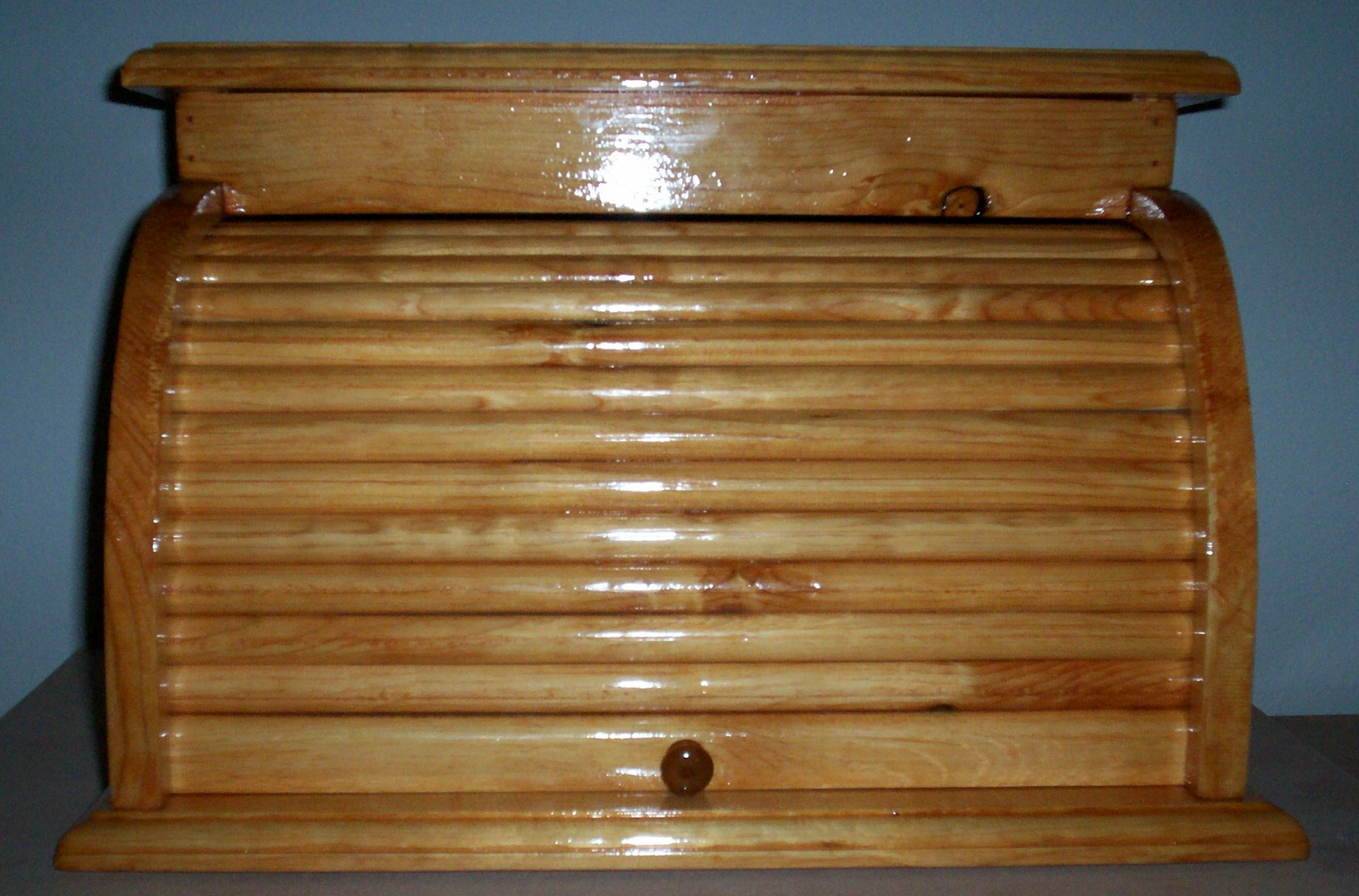 Bread box with roll up door. Different colored stains available
